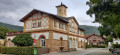 Ancienne maison communale dans un quartier ouvrier à Kuchen